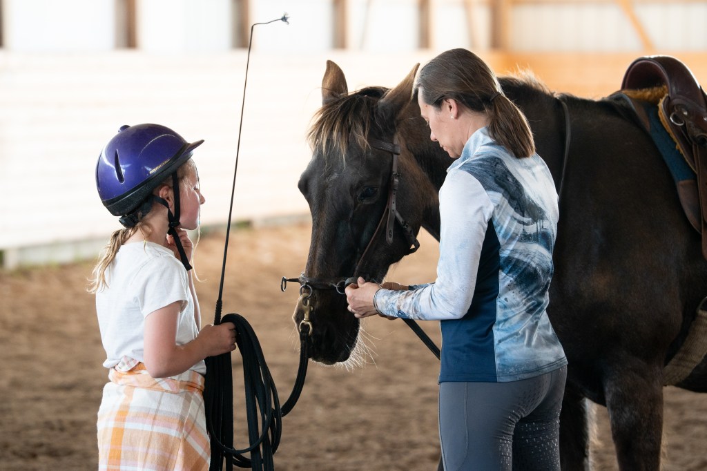 Nicole Carlon with young student