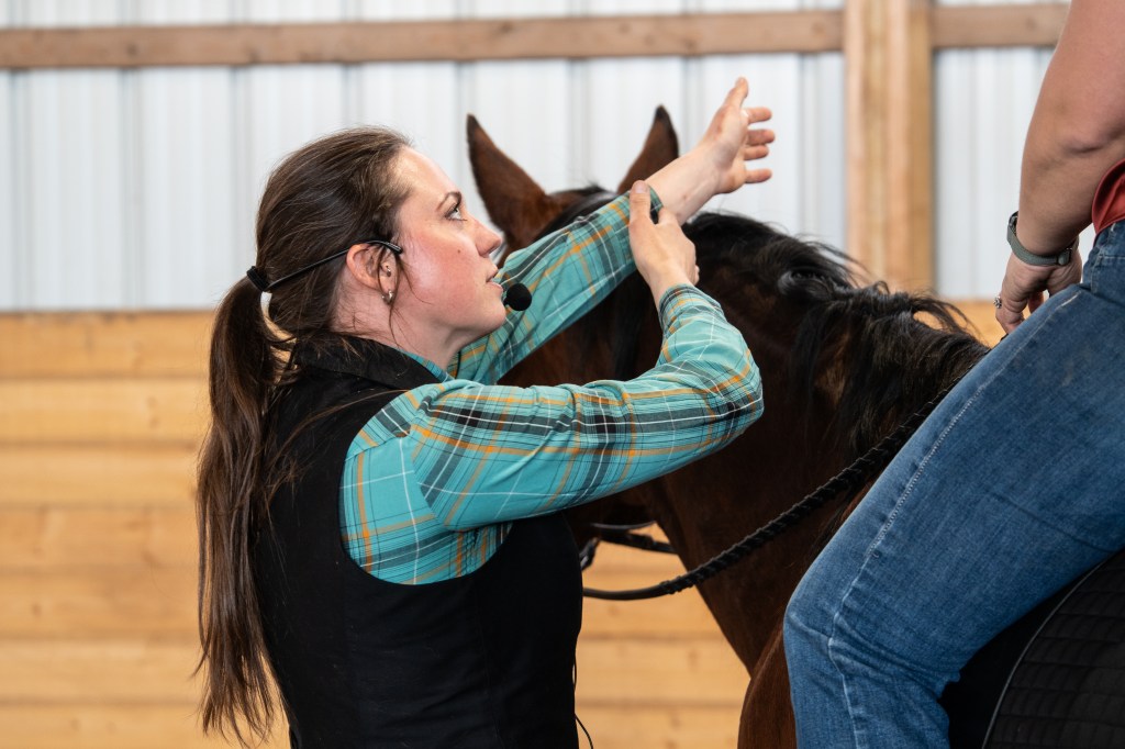 Amy Skinner giving instruction to rider